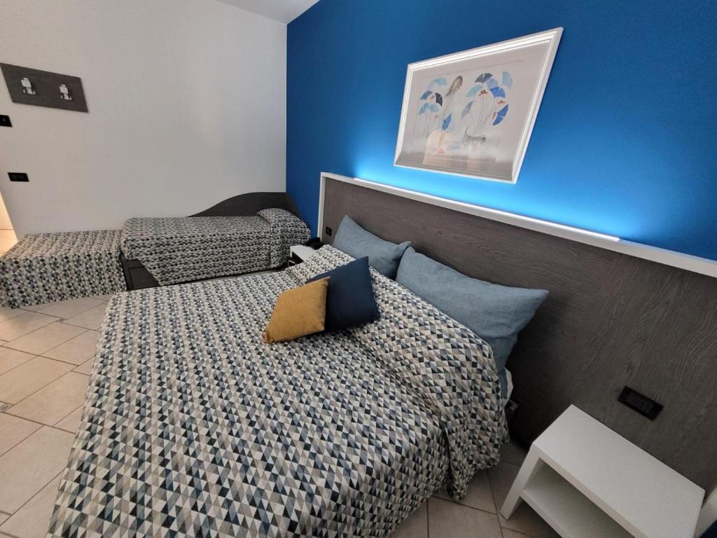 Postel nebo postele na pokoji v ubytování Maritan Hotel & Spa