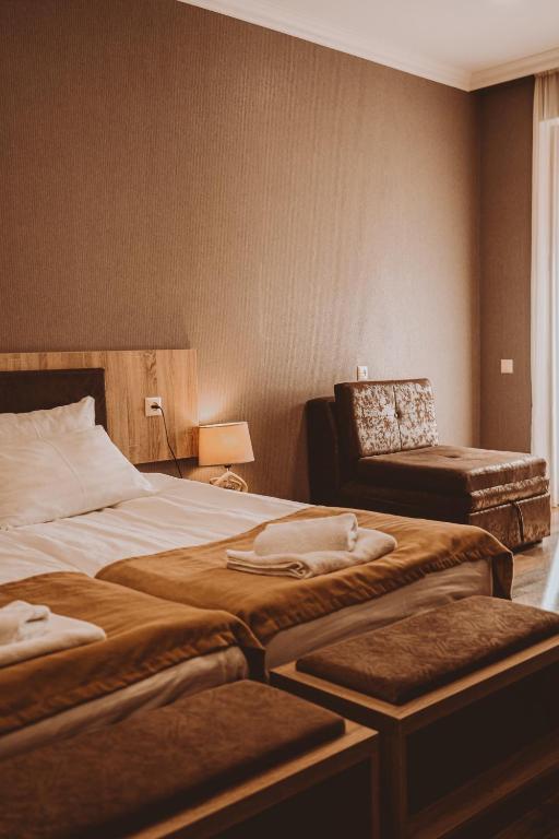 Кровать или кровати в номере Suntower Hotel