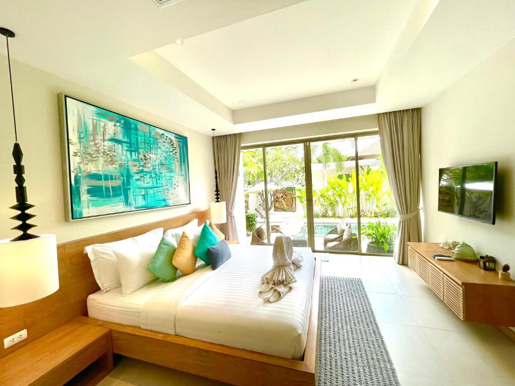Postel nebo postele na pokoji v ubytování Superbe villa tropicale avec piscine privée Phuket