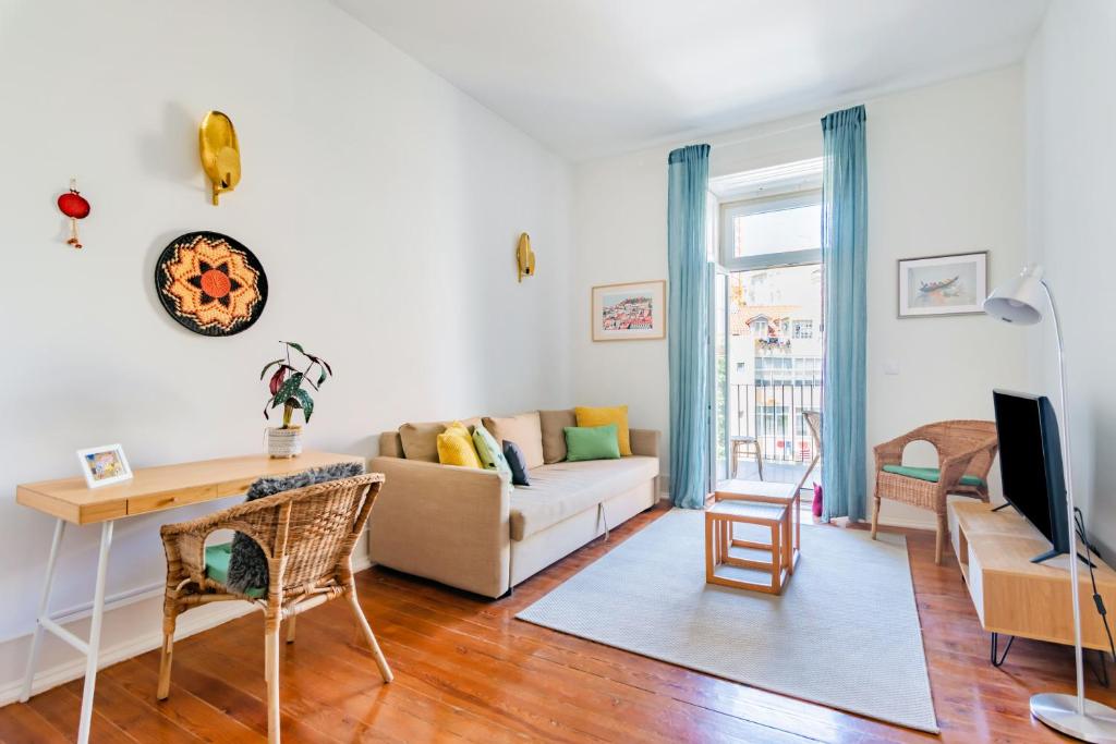 a living room with a couch and a table at Conde 3BDR Luxury in Lisbon