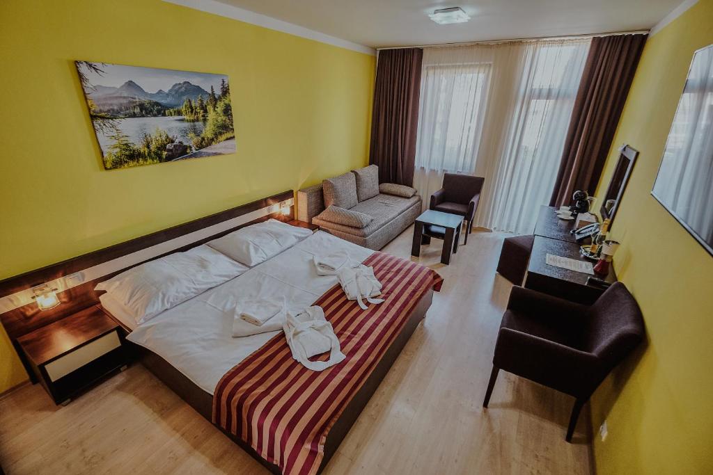 Ліжко або ліжка в номері Apartmany Gino Besenova