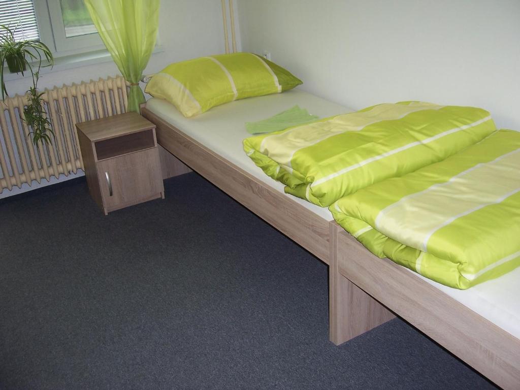 Postel nebo postele na pokoji v ubytování Penzion Na Rozcestí