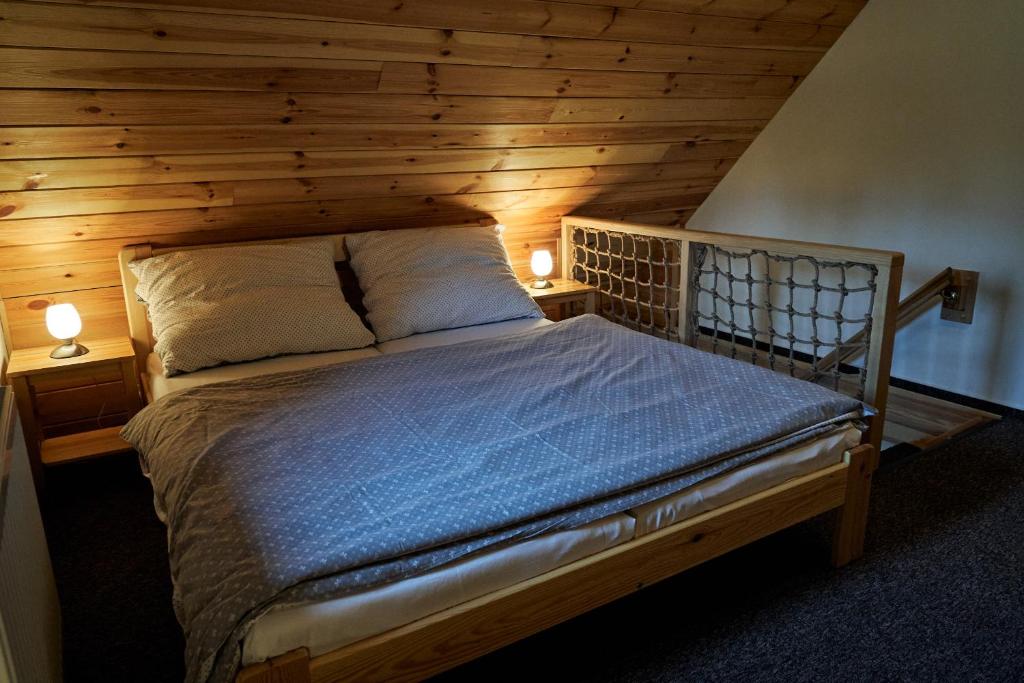 Postel nebo postele na pokoji v ubytování Apartmány Pod Stráni