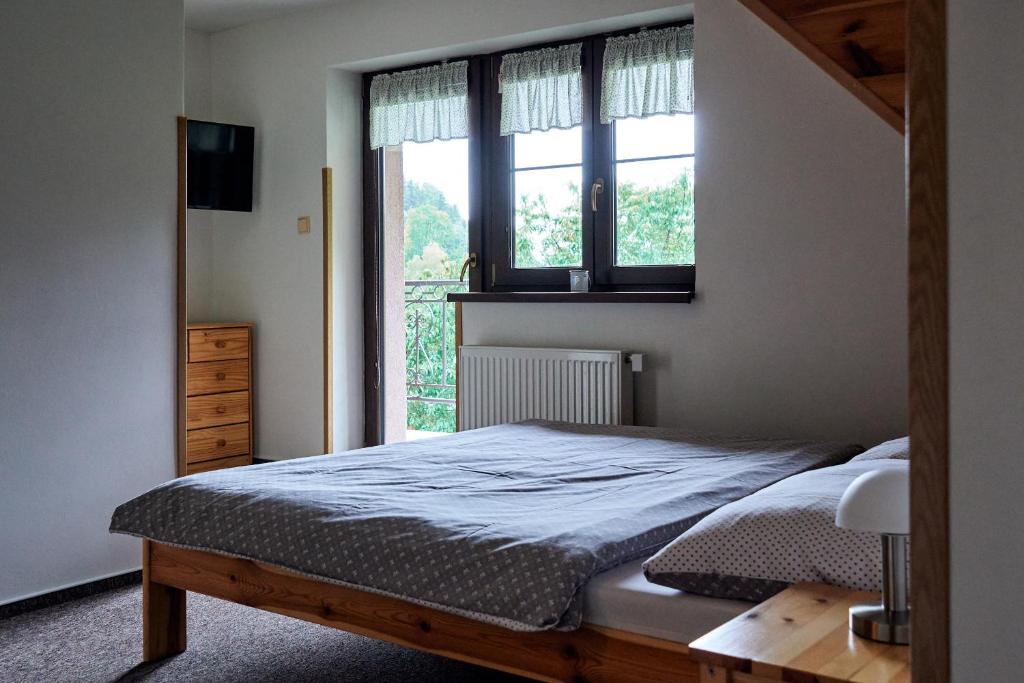 Postel nebo postele na pokoji v ubytování Apartmány Pod Stráni