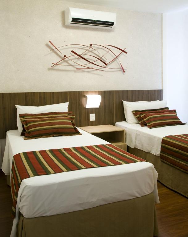 Postel nebo postele na pokoji v ubytování Pampulha Lieu Hotel