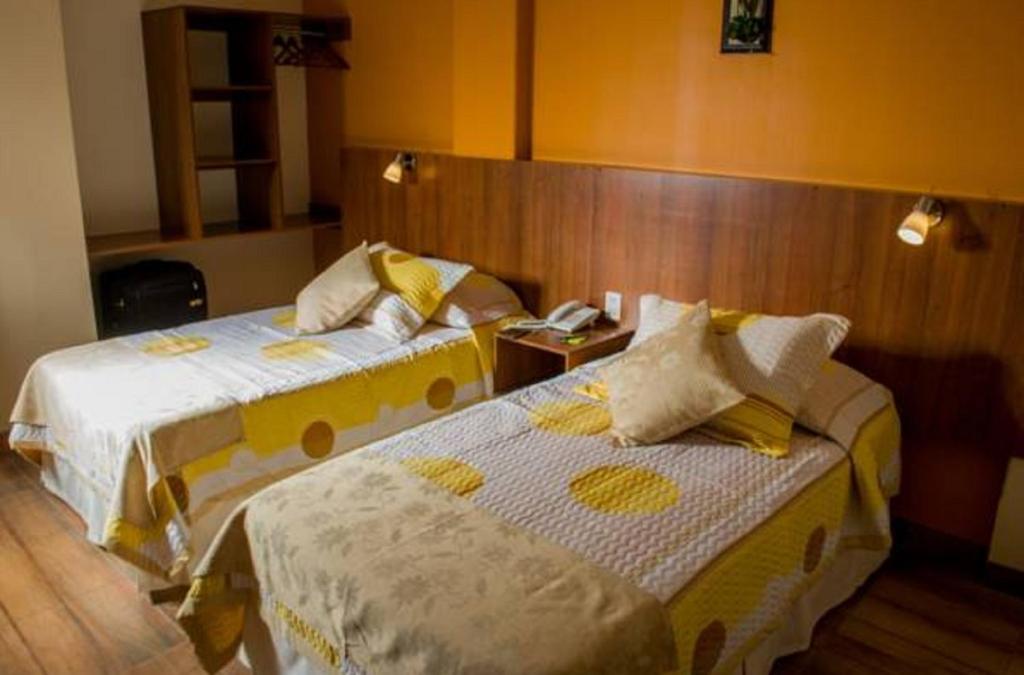 Postel nebo postele na pokoji v ubytování Hotel Mitru - Tarija