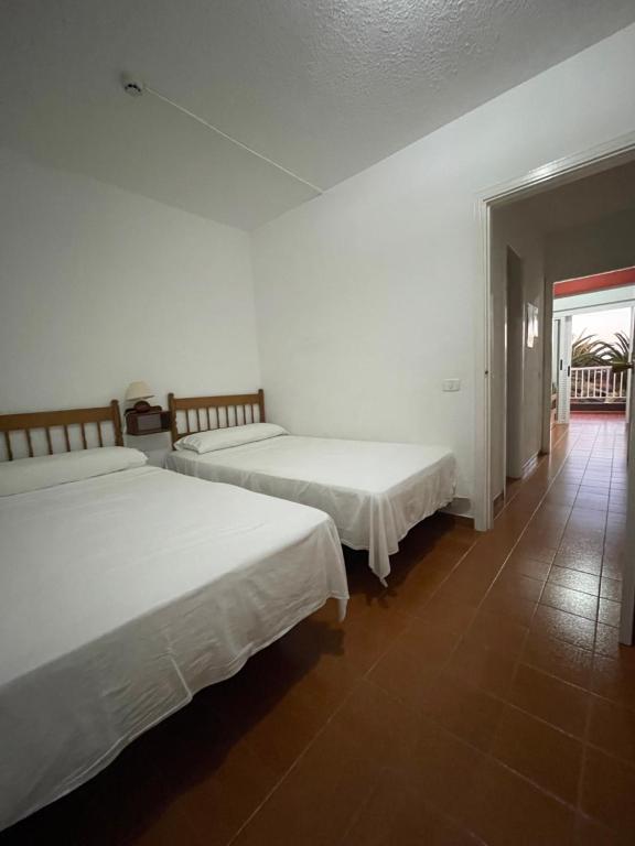 Postel nebo postele na pokoji v ubytování Apartamentos Los Tarajales