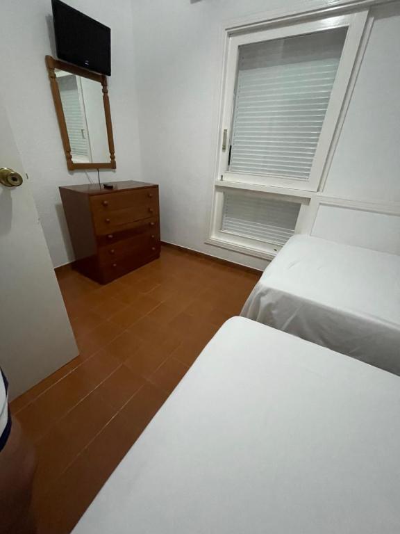Postel nebo postele na pokoji v ubytování Apartamentos Los Tarajales
