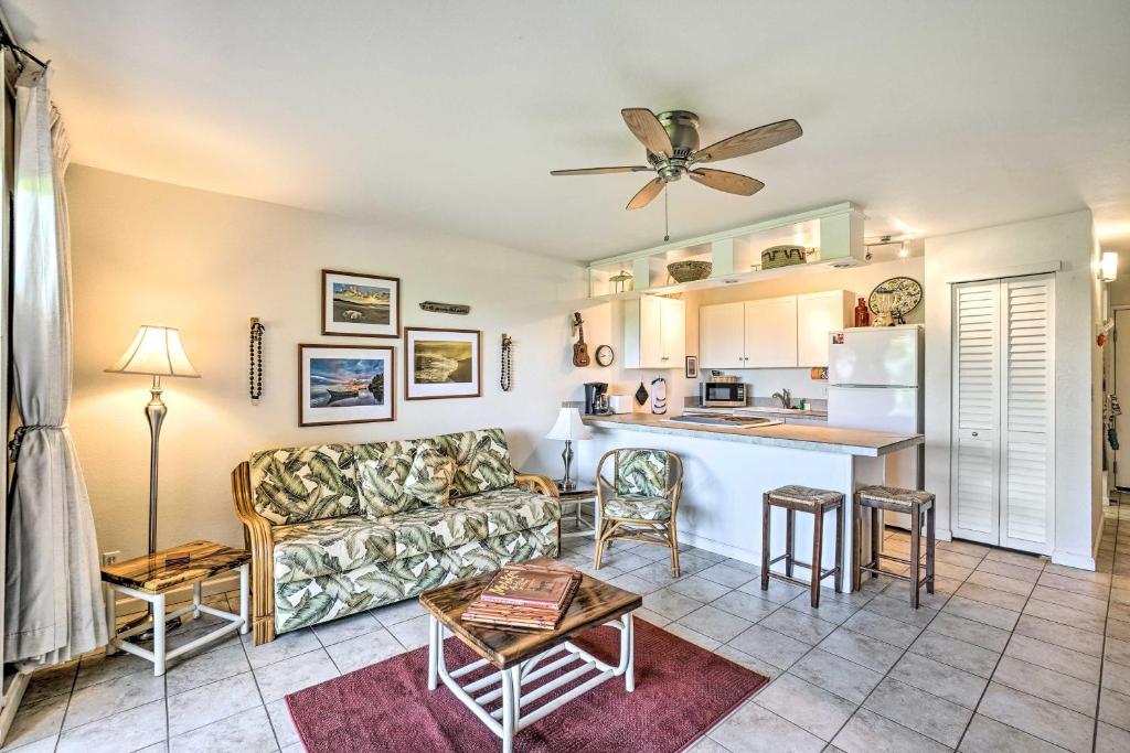 a living room with a couch and a kitchen at Kaunakakai Escape Heated Pool and Beach Access in Kaunakakai