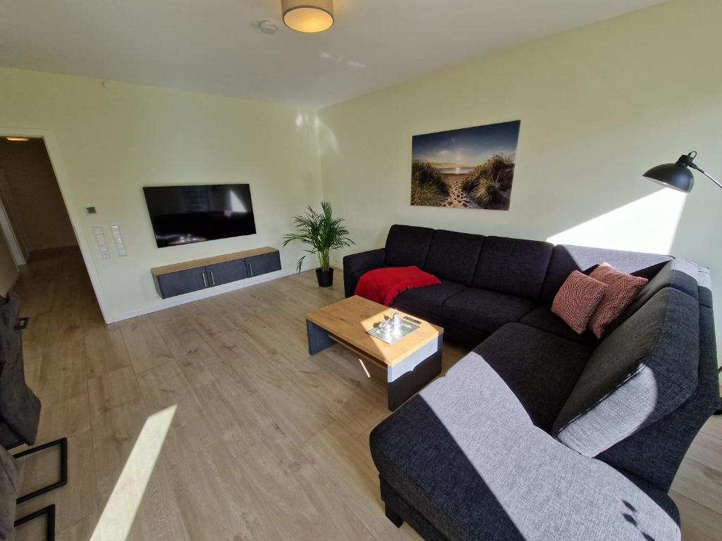 Posezení v ubytování Apartment nahe Meyer Werft in Ostfriesland mit Küche & Netflix