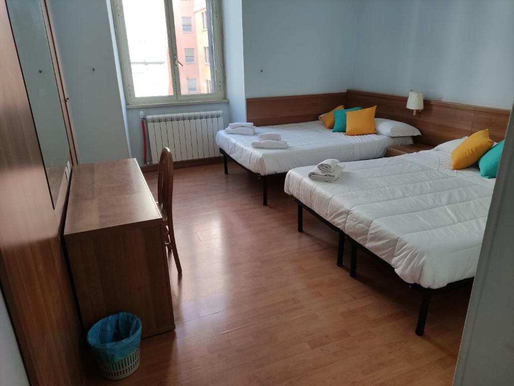 Postel nebo postele na pokoji v ubytování Hotel Big Bang