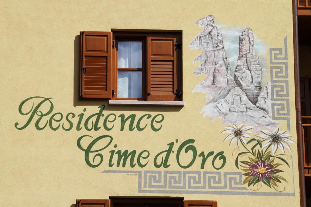 a wall with a window and the words resistance time zone at Residence Cime d'Oro in Andalo