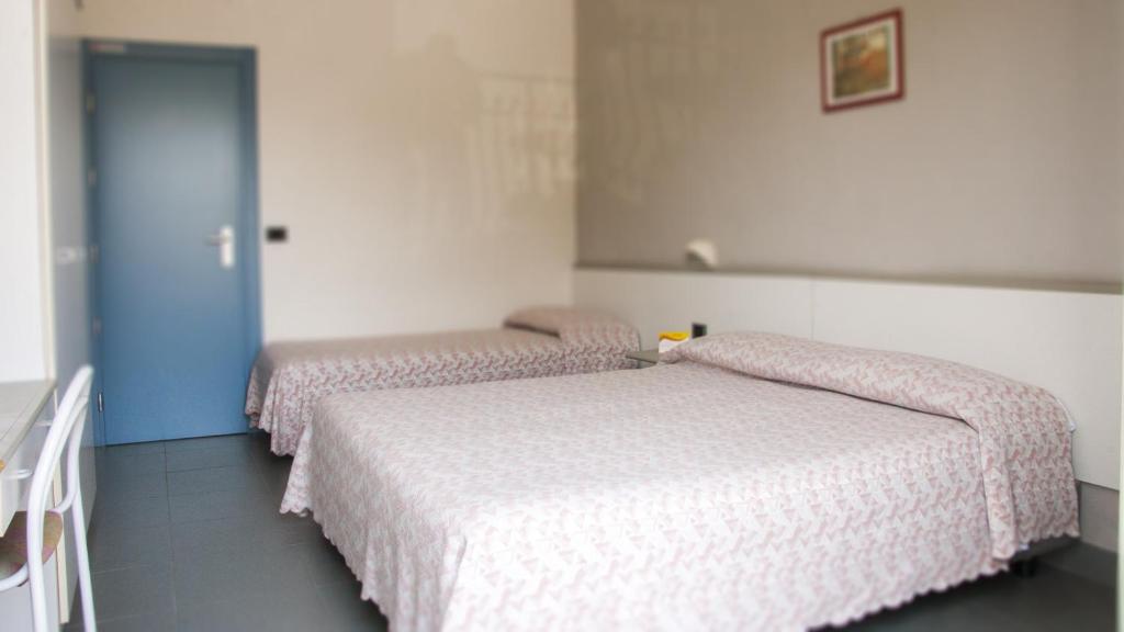 Postel nebo postele na pokoji v ubytování B&B Hotel Souvenir