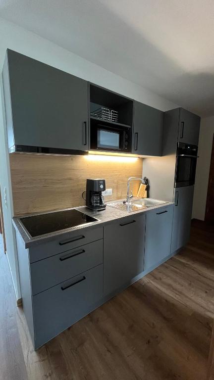 Kuchyň nebo kuchyňský kout v ubytování Alpenresidenz M Vermietungs KG