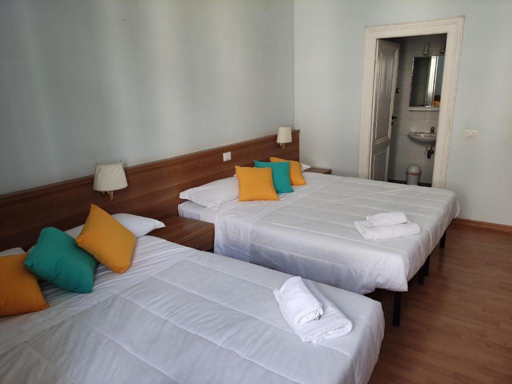 Postel nebo postele na pokoji v ubytování Hotel Big Bang