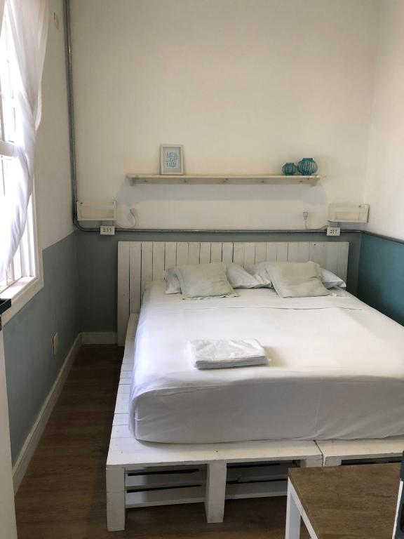 Postel nebo postele na pokoji v ubytování Angatu Hostel
