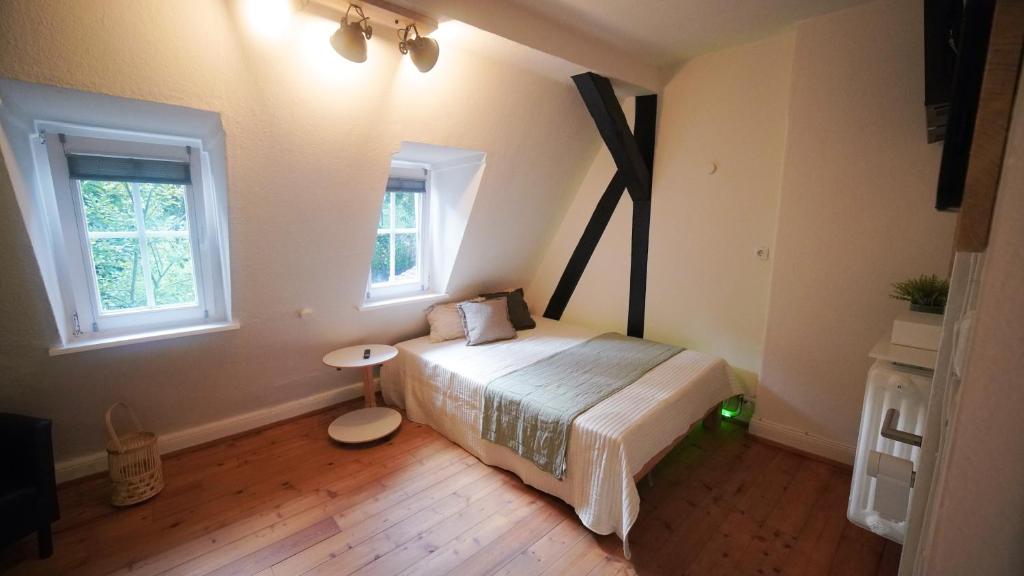 Giường trong phòng chung tại Marburg Living
