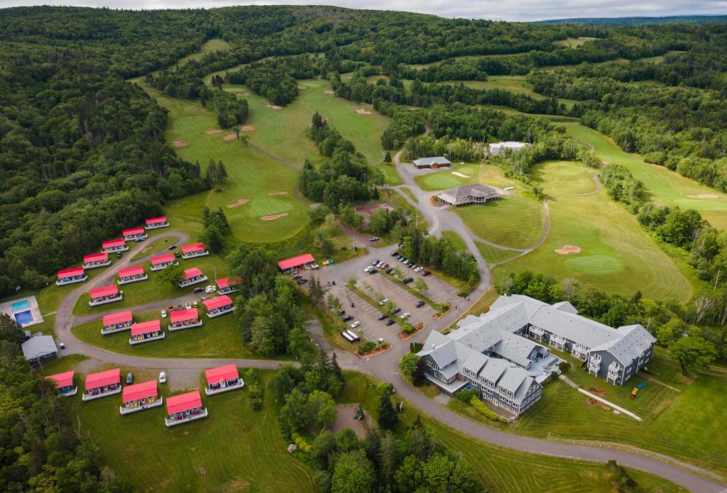 an aerial view of a park with a large building at Dundee Resort & Golf Club in West Bay