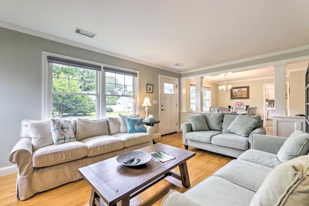 a living room with two couches and a table at Charming Old Saybrook Cottage Less Than 1 Mi to Beach in Old Saybrook