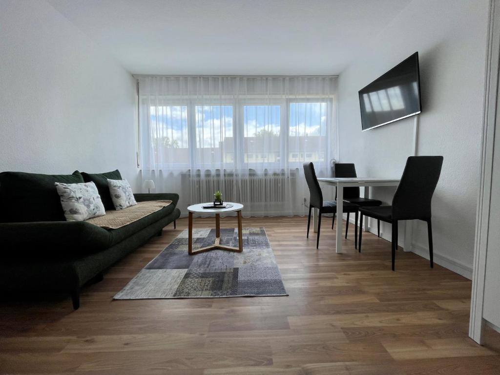 a living room with a couch and a table at Adriana Apartment , Free Parking in Baden-Baden
