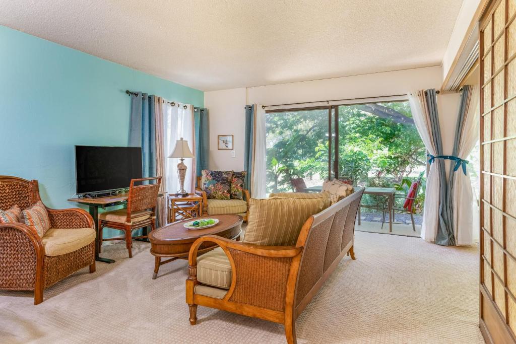 a living room with a couch and a table at Hale Honu in Waikoloa Village