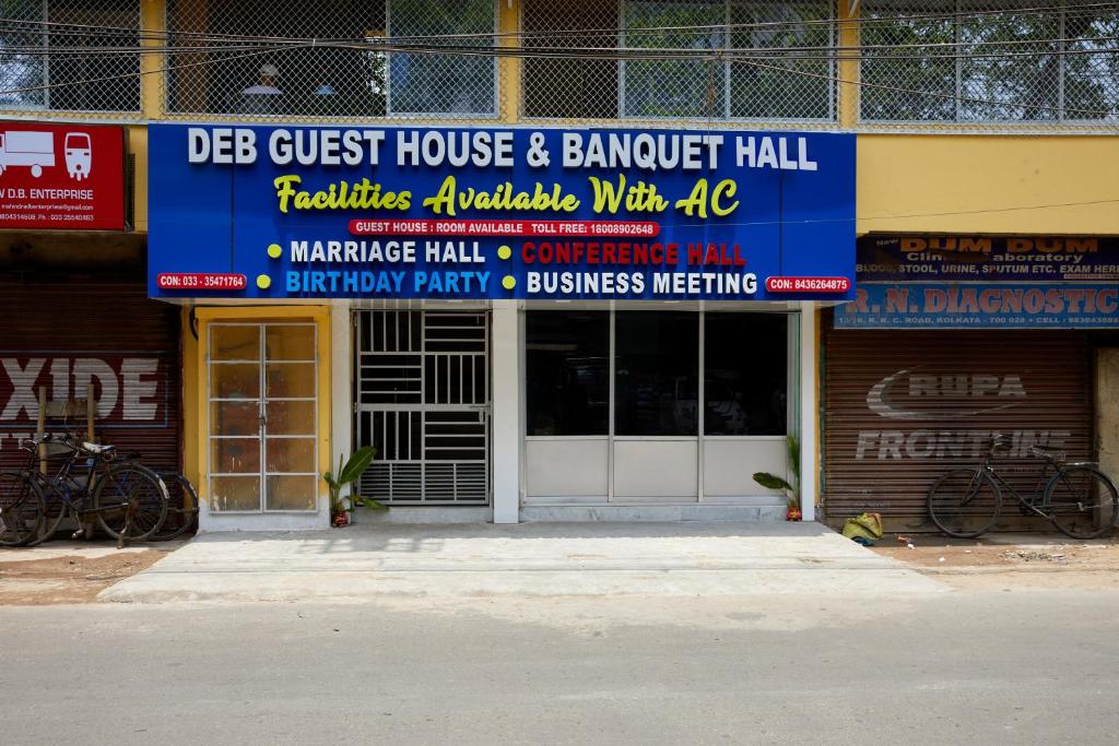 a building with signs on the front of it at deb Guest House And Banquet hall in Kolkata