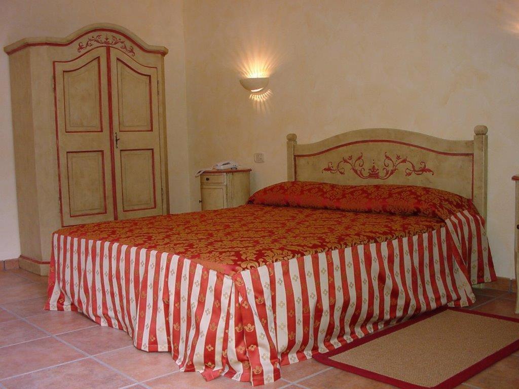 Postel nebo postele na pokoji v ubytování Hotel Adda