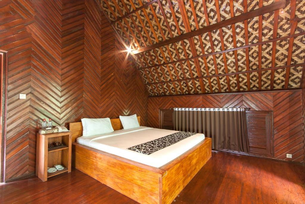 Postel nebo postele na pokoji v ubytování Bali Jungle Resort
