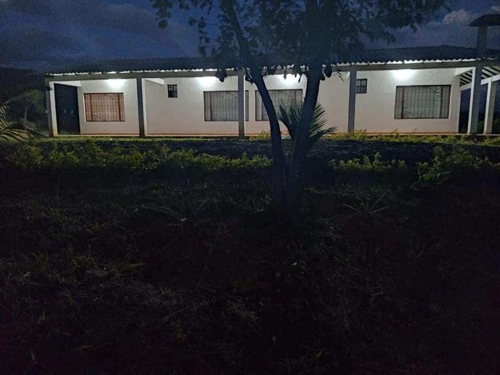 a house lit up at night with lights at Mirador de la cuesta in Tres Esquinas