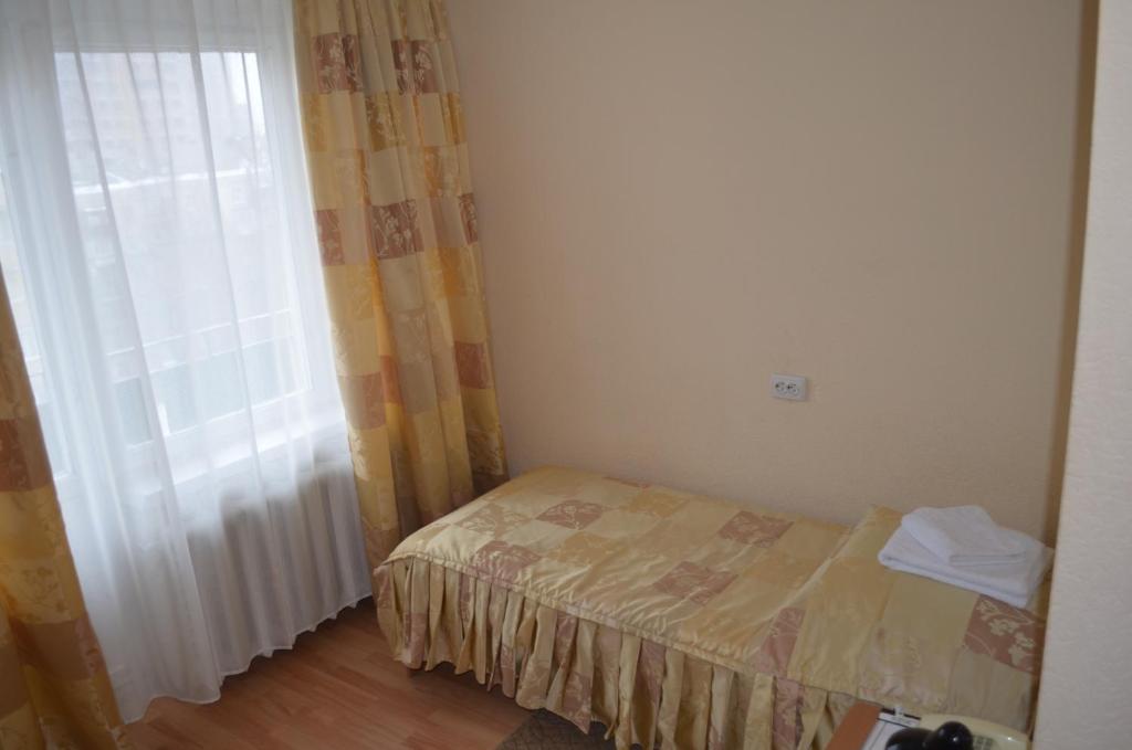 Postel nebo postele na pokoji v ubytování Predslava Hotel