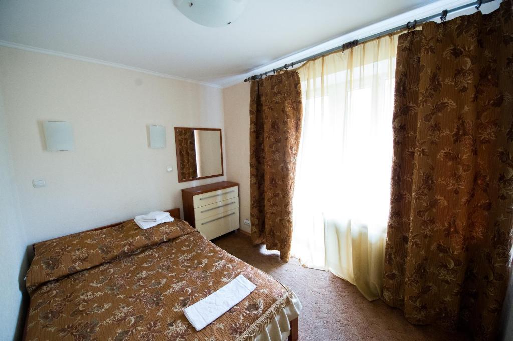 Postel nebo postele na pokoji v ubytování Predslava Hotel