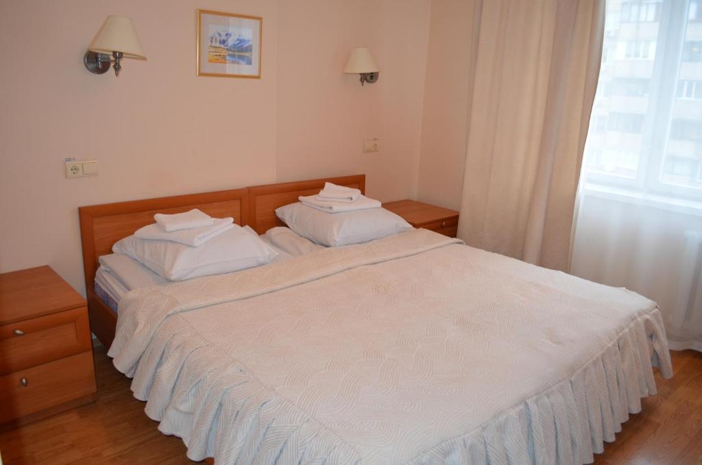 Postel nebo postele na pokoji v ubytování Predslava Hotel