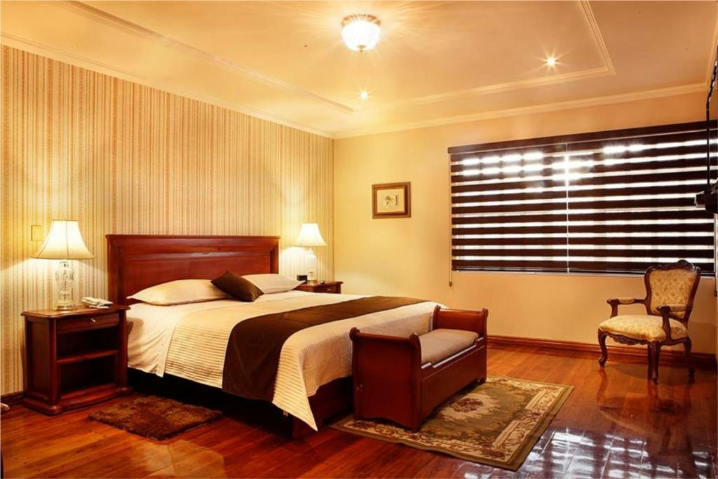 Postel nebo postele na pokoji v ubytování Villa Emilia Hostal