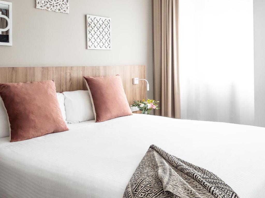 Postel nebo postele na pokoji v ubytování Vilana Hotel Boutique