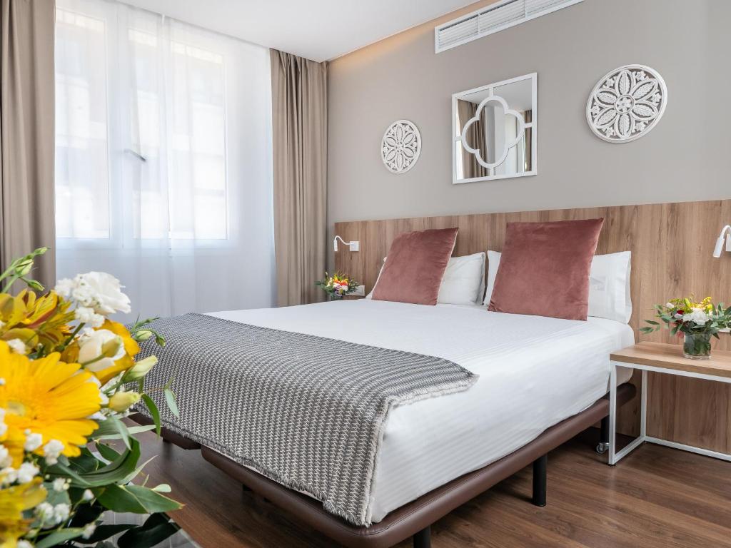 Postel nebo postele na pokoji v ubytování Vilana Hotel Boutique