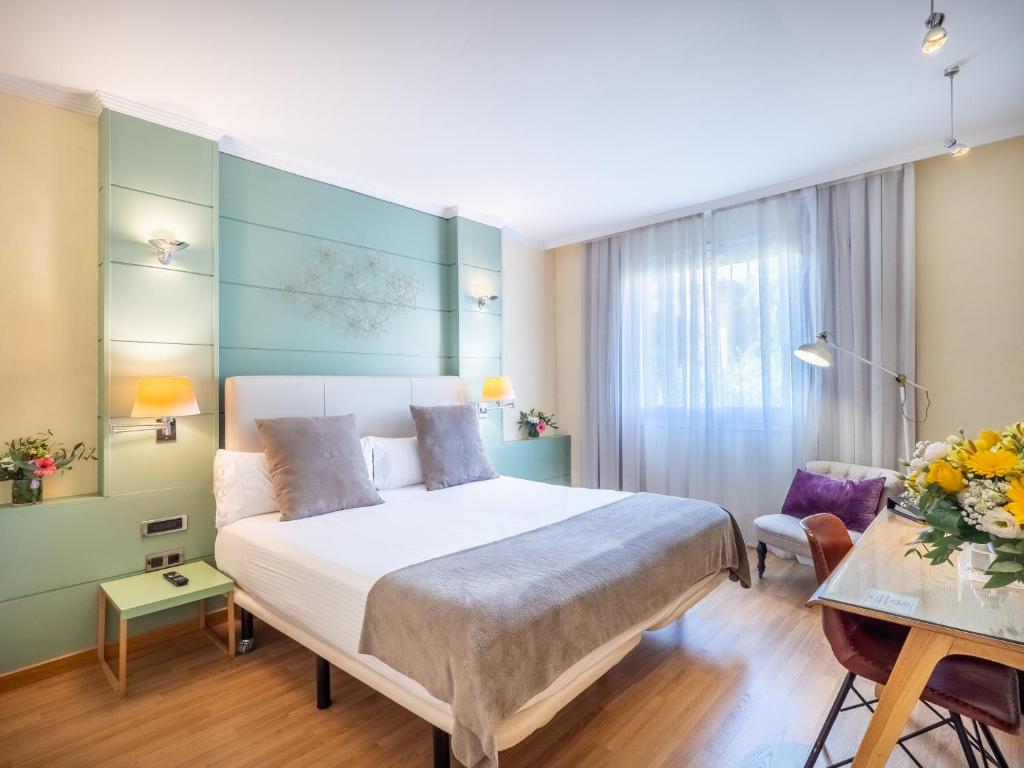 Postel nebo postele na pokoji v ubytování Vilana Hotel Boutique