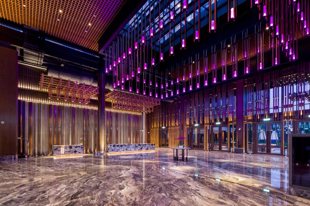 an empty room with chairs and lights in a building at M Resort & Hotel Kuala Lumpur in Kuala Lumpur