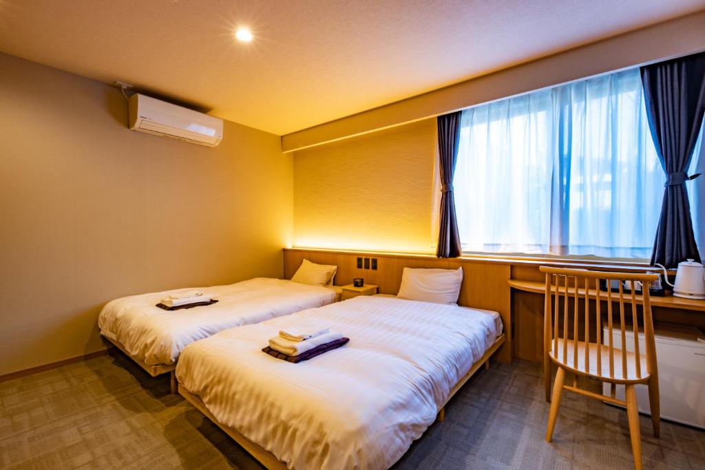 Letto o letti in una camera di CURIO Shirakawago