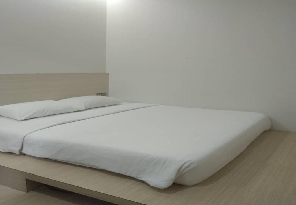 Postel nebo postele na pokoji v ubytování Minimalist Hotel