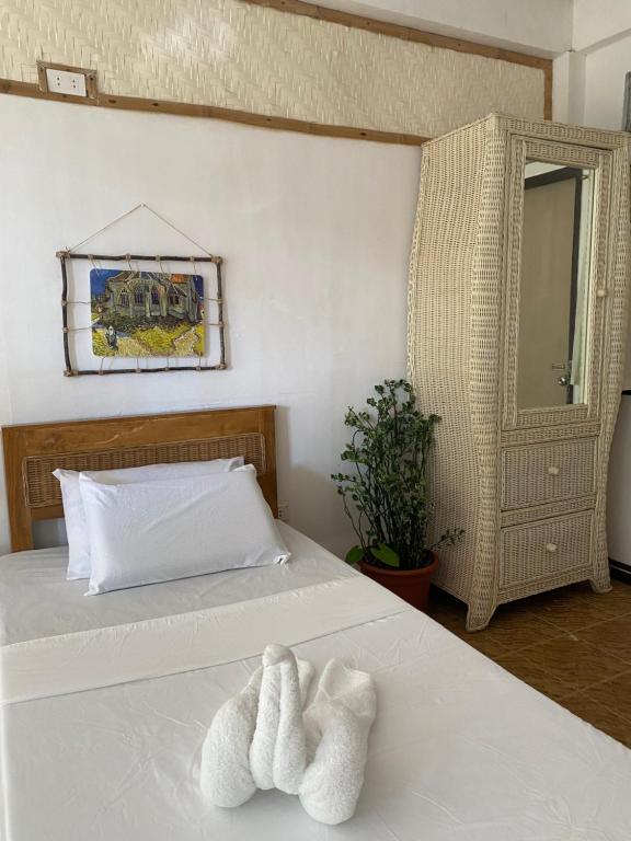 Postel nebo postele na pokoji v ubytování Tahanan Resort