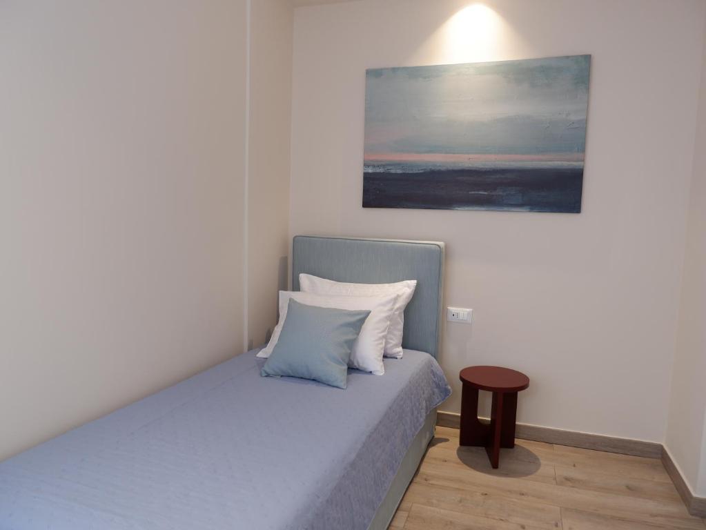 Postel nebo postele na pokoji v ubytování Kaiser Luxury Suites