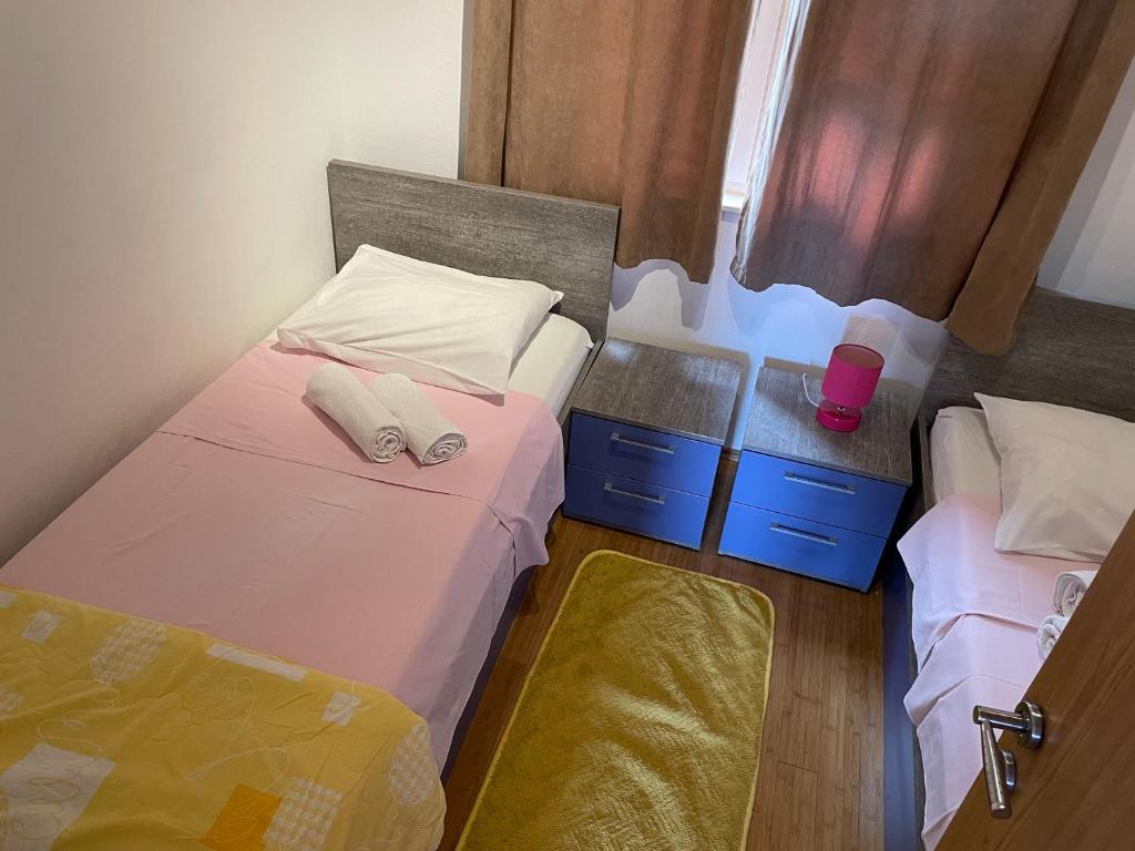 Posteľ alebo postele v izbe v ubytovaní Apartments Dumina