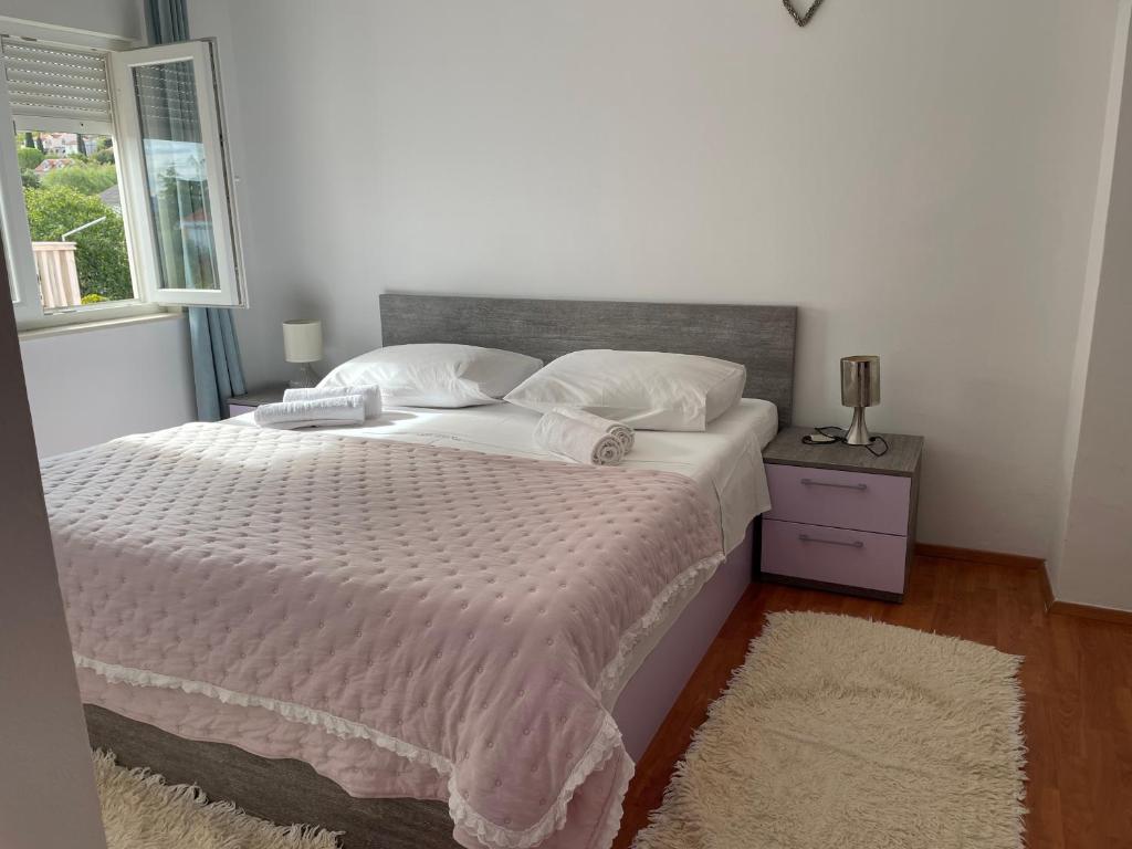 Posteľ alebo postele v izbe v ubytovaní Apartments Dumina