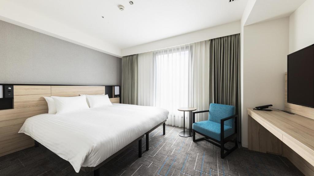 Postel nebo postele na pokoji v ubytování JR East Hotel Mets Premier Gotanda