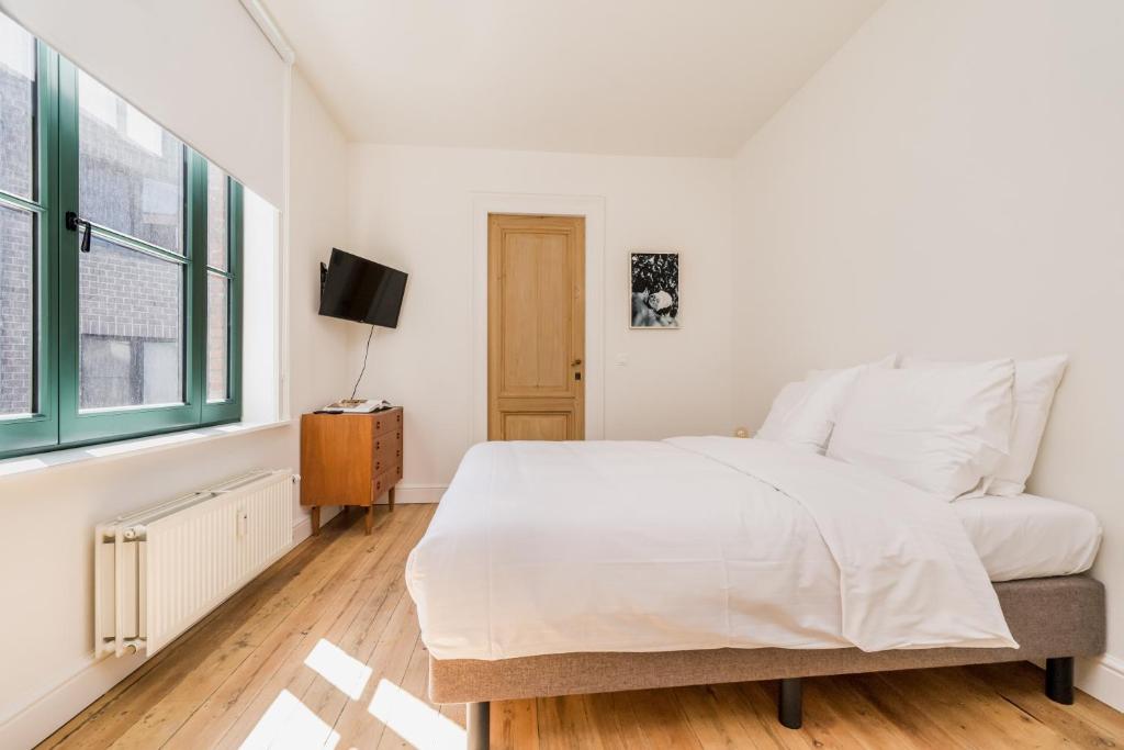 Postel nebo postele na pokoji v ubytování Quartier Le Sud