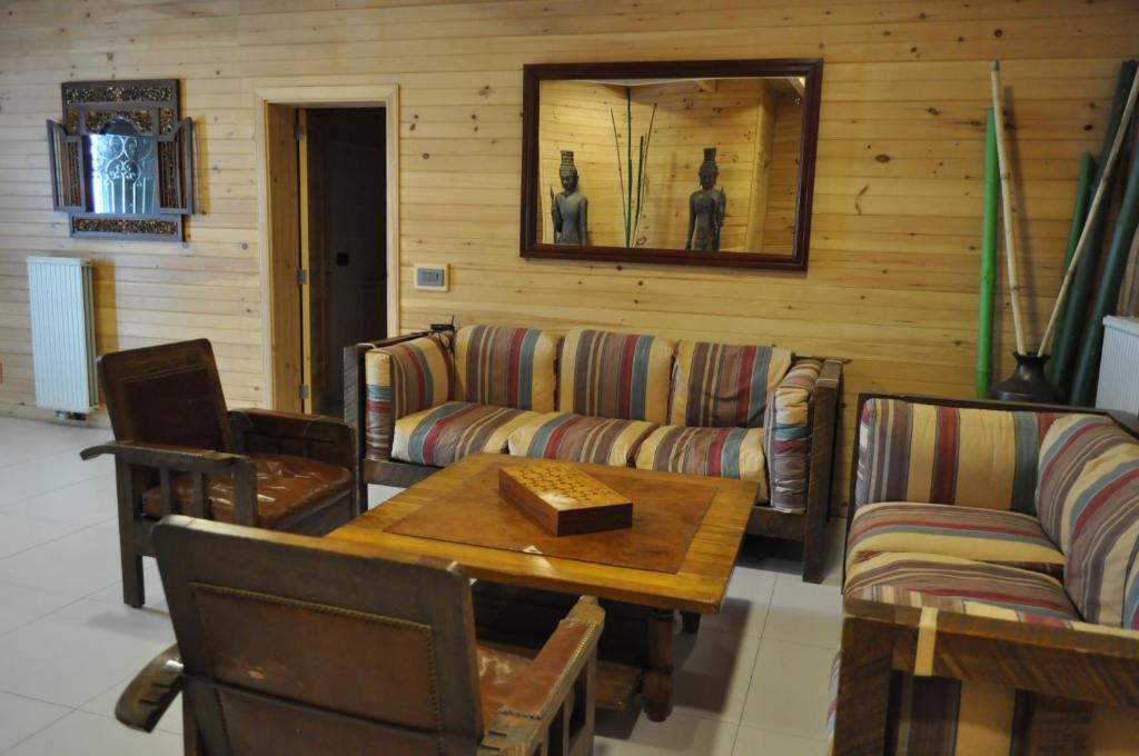 a living room with a couch and a table at Chalet de Charme, Cedars, Lebanon, Terrace Floor in Al Arz