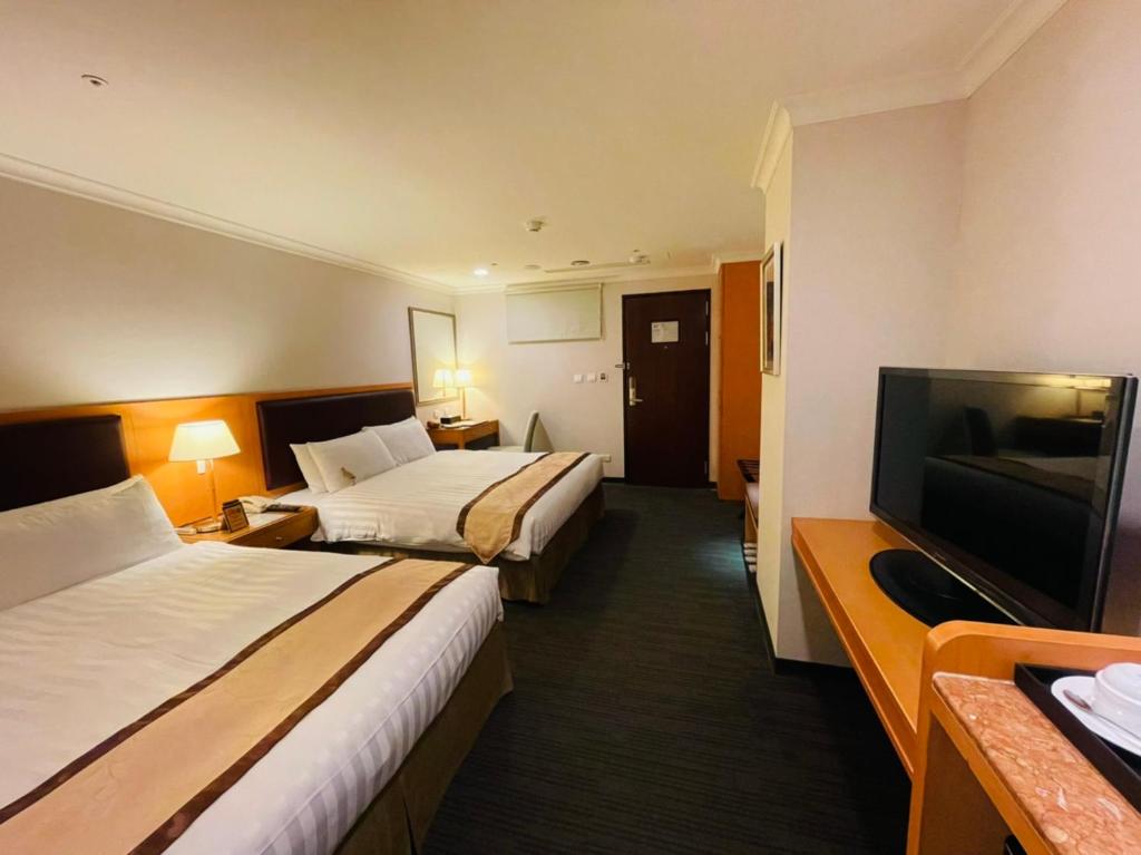 TV a/nebo společenská místnost v ubytování Fuward Hotel Tainan