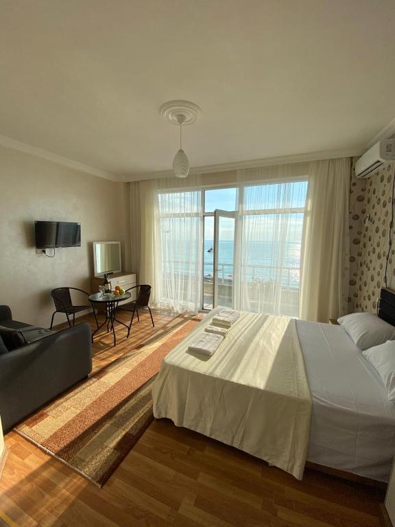 Postel nebo postele na pokoji v ubytování SARPI HOTEL NUMA