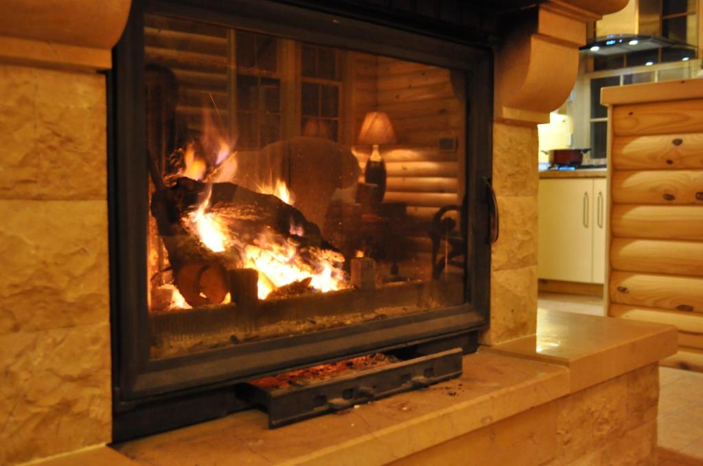 a fireplace with a turkey baking in it at Chalet de Charme, Cedars, Lebanon, Balcony Floor in Al Arz