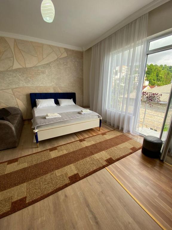 Postel nebo postele na pokoji v ubytování SARPI HOTEL NUMA